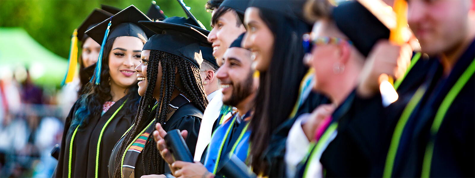 Graduates standing side by side