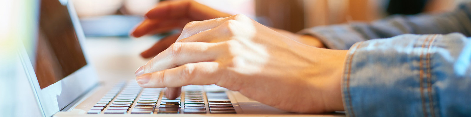 hands on a laptop keyboard