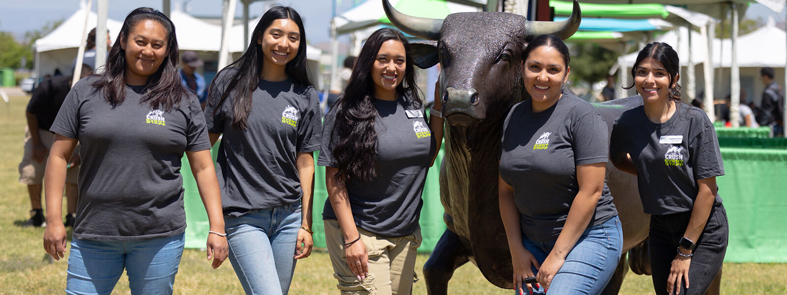 Group of ladies taking a group photo at college event