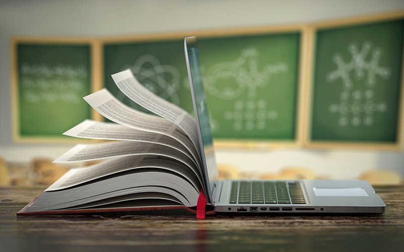 Book and laptop side by side