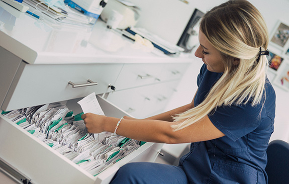 A selection of images of medical office administrators at work