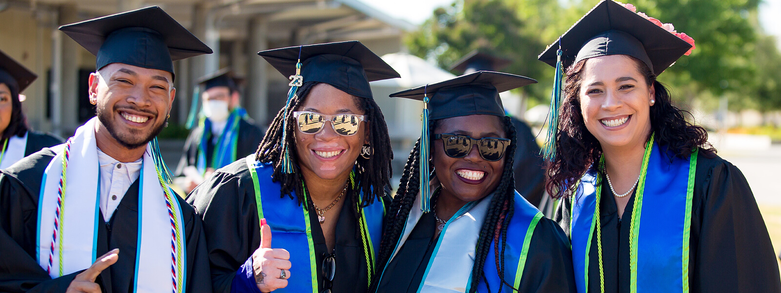 group photo of black students at graduation ceremony