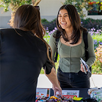 Woman at job fair smiling