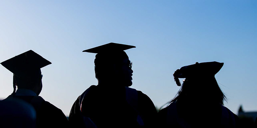 silhouette of students graduating