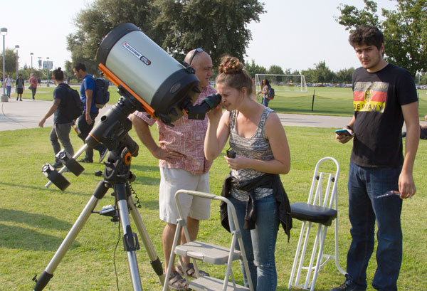 student with telescope