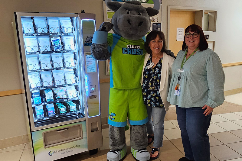 crush mascot with 2 health services staff members